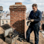 Chimney sweep cleaning brownstone roof chimney