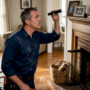 Chimney sweep inspecting flue in home
