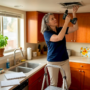 Property manager inspects kitchen vent cover