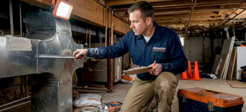 HVAC technician measures basement air duct sizing