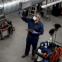 Janitorial trainer demonstrating vent cleaning