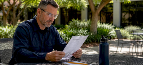 Facility manager reviewing duct cleaning cost invoice
