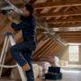 Technician installing home ventilation ducts