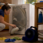 Homeowner inspecting dryer vent connection
