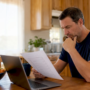 Homeowner reviewing duct cleaning options at home