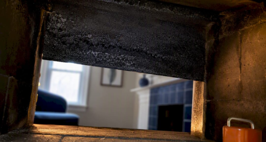 Creosote buildup inside a masonry chimney flue