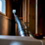 Rigid dryer vent route inspected in utility space