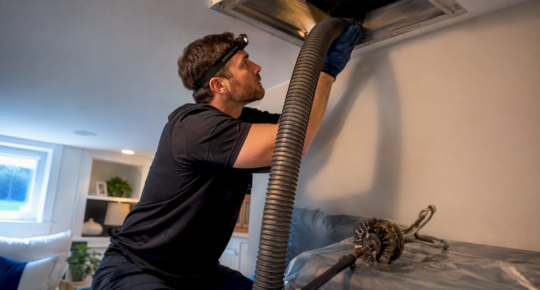 Technician setting up duct extraction