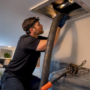Technician setting up duct extraction