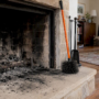Black soot coating a home fireplace hearth