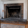 Soot-darkened summer fireplace with open damper
